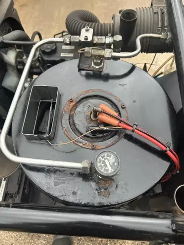 Burner assembly reinstalled on Nilfisk Contractor diesel hot pressure washer after boiler repair.